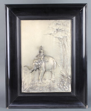 A plated repousse panel of a rider on an elephant, a ditto of a rider on a camel, framed 39cm x 26cm 