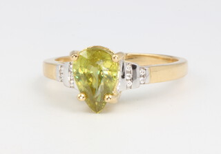 An 18ct yellow gold peridot and diamond ring, 6 grams, size T
