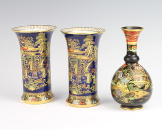 A pair of Carlton Ware blue ground vases decorated with chinoiserie scenes 15cm together with a black ground ditto decorated with figures before pavilions 16cm 