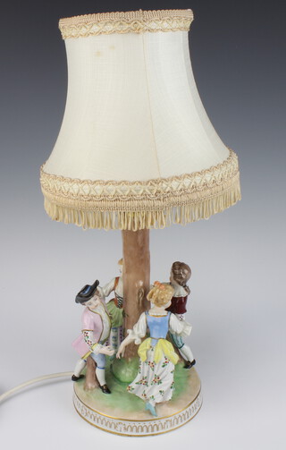 A modern Dresden table lamp in the form of a 4 figures dancing round a tree 24cm  