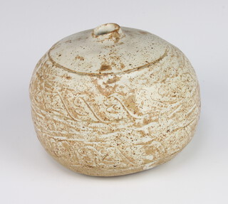 A spherical studio pottery vase with incised decoration 10cm 