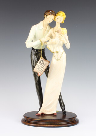 A Capodimonte group of a mother father and child, signed A Santini 42cm 