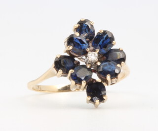 A 14ct yellow gold sapphire and diamond cluster ring, 2.8 grams, size M 1/2