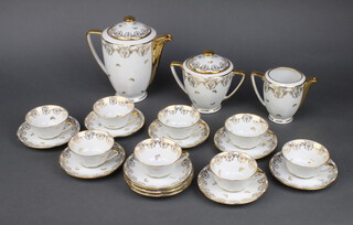 A Limoges porcelain cream and gilt coffee service comprising coffee pot, sugar bowl, cream jug, 8 tea cups and 10 saucers