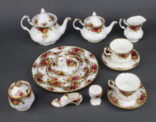 A Royal Albert Old Country Roses part tea set comprising 8 small tea cups, 9 saucers, 1 large tea cup, 1 saucer, teapot (stuck spout), milk jug, sugar bowl, breakfast teapot, 4 small dessert bowls (seconds), 4 large dessert bowls, preserve jar and cover, 2 shoe ornaments, a ring tidy (second), 2 napkin rings and napkins, 2 dishes, an ashtray, a sauce boat and stand (seconds), sandwich plate (cracked), an oval meat plate, a leaf shaped dish (cracked), 3 egg cups, 7 side plates, 6 medium plates (1 a second), 6 dinner plates 