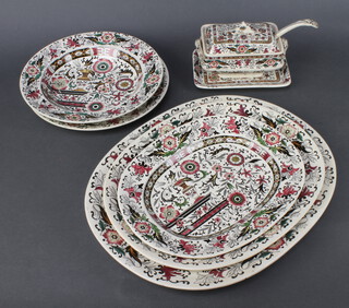 An Edwardian Turkish decoration part dinner service comprising 2 small tureens and covers (1 cover chipped), sauce tureen, lid and ladle (ladle stuck), 2 tureen stands, a sauce boat (cracked), a large tureen and lid, 3 oval meat plates, a rectangular meat plate, 7 dinner plates (1 chipped), 6 soup bowls (1 cracked)