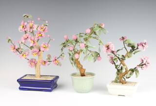 Three modern Chinese coloured glass floral displays 