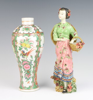 A 19th Century Cantonese baluster vase decorated with panels of figures, pavilion landscapes and insects 27cm together with a 20th Century Chinese figure of a female flower seller 30cm 