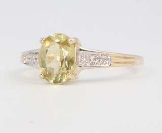 A 9ct yellow gold peridot and diamond ring 1.9 grams, size O 
