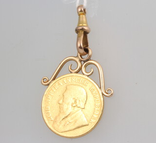 A gold one pond 1896 contained on a 9ct clasp 10.1 grams gross