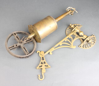A Victorian pierced brass bottle jack bracket complete with bottle jack and key 
