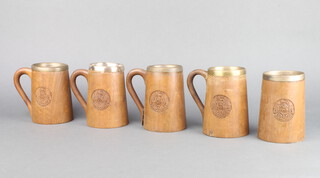 A set of 5 Indian carved hardwood tankards with metal liners decorated The Badge of the 7th Punjab Regiment  