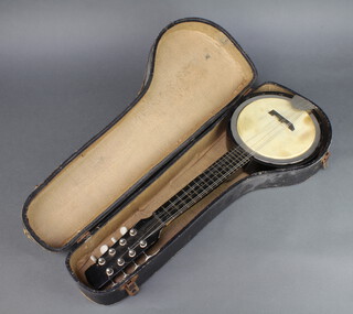 An 8 stringed banjo mandolin patent no. 25221-45 complete with carrying case 