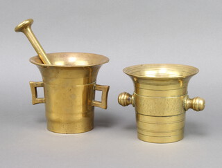 A 17th/18th Century gilt metal twin handled mortar 12cm x 3cm (chip to the rim) together with an associated pestle, 1 other twin handled mortar 12cm x 12cm 