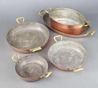 An oval copper and brass West German twin handled saucepan 8cm h x 21cm x 15cm, ditto dish 3cm x 30cm w x 7cm d and 3 circular dishes  
