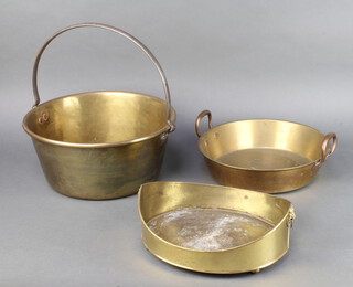 A Georgian style boat shaped brass planter with twin handles, raised on bun feet 10cm h x 30cm w x 27cm d, a circular copper and brass twin handled preserving pan 7cm x 31cm and a copper and steel preserving pan 16cm x 35cm 