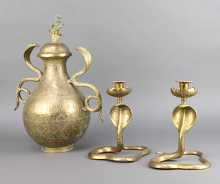 A Benares brass twin handled urn and cover with cobra handles 36cm h x 21cm d together with a ditto pair of cobra candlesticks 