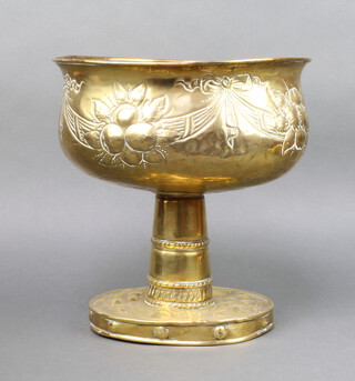 A Victorian oval embossed brass pedestal bowl raised on an oval foot 31cm x 30cm x 26cm 