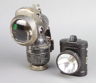 A Lucas carbide bicycle lamp together with an Eveready GPO torch 