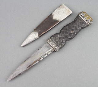 A Scottish dirk with 10cm blade contained in a leather and silver mounted scabbard by Henry Tatton Edinburgh 1919 