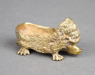 A Victorian brass pen wipe/pin cushion in the form of a hedgehog, the base marked GES6R91 3cm h x 5cm w x 3cm d  