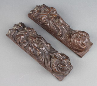 A pair of Victorian oak scrolls carved The Green Man 6cm x 22cm x 6cm  