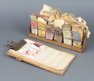 A 1930's ticket clip with numerous railway and bus tickets, a small wooden clipboard, a London passenger transport board bus log card and a 1953 Coronation souvenir  