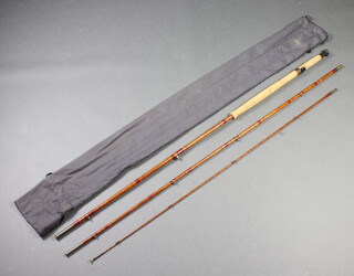 A Hardy general purpose 10' salmon fishing rod marked The General Rod and contained a grey fabric cloth bag 