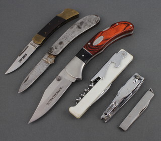 A Winchester folding pocket knife with 8cm blade, steel and mahogany grip, an Explorer ditto marked 404 stainless Japan, 2 other folding knives, a waiters friend and an In-Fisherman folding multi-tool 
