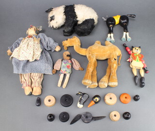 Two wooden puppets (1f), a spelter figure of a standing gentleman 15cm, ditto figure of a camel 19cm, ditto standing cow 29cm and a panda 14cm  