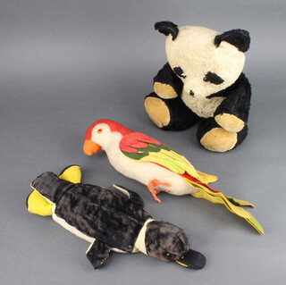 A Merrythought figure of a parrot 42cm x 10cm (slight moth damage to beak), a felt figure of a penguin 38cm (worn in places and slight moth damage) and a panda  