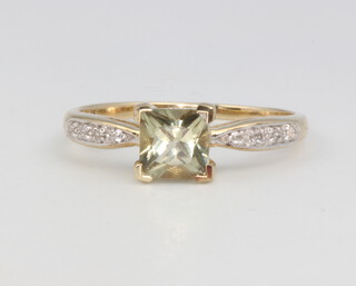 A 9ct yellow gold peridot and diamond ring 2.1 grams, size R 1/2