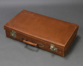 A light brown leather suitcase with chrome mounts 16cm h x 76cm w x 42cm w 