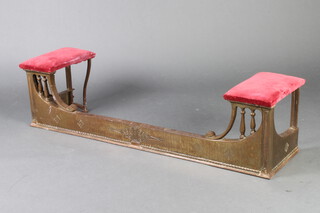 An Art Nouveau cast iron club style fender with 2 seats to the side 33cm h x 137cm w x 32cm d 