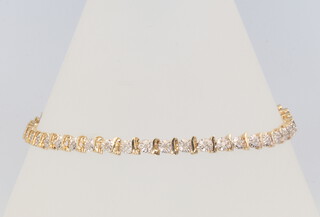 A 9ct yellow gold diamond tennis bracelet, 19cm, 6.4 grams gross 