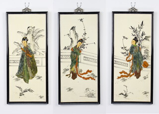 A set of three Chinese panels decorated with soapstone figures 48cm by 26cm