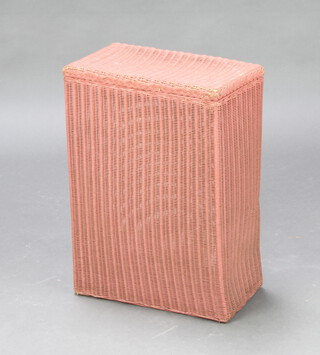A rectangular pink painted Lloyd Loom linen basket with hinged lid 53cm h x 39cm w x 22cm d (label to interior)