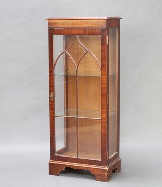 A Georgian style mahogany display cabinet, fitted adjustables shelves enclosed by astragal glazed panelled door, raised on bracket 122cm h x 49cm w x 31cm d 