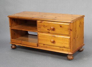 A rectangular pine cabinet fitted 2 drawers flanked by shelves 54cm h x 109cm w x 44cm d  