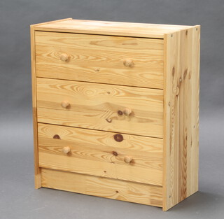 A rectangular pine chest of 3 long drawers with tore handles raised on a platform base 70cm h x 61cm w x 30cm d 