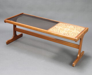 A rectangular teak coffee table with smoked glass panel and tiled top 45cm h x 121cm w d 50cm d 
