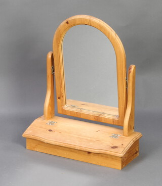 A rectangular plate dressing table mirror contained in a pine frame raised on a rectangular base 59cm h x 48cm w x 18cm 