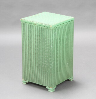 A square green painted Lloyd Loom linen basket with hinged lid, the base dated 1st January 1955 56cm h x 31cm w x 32cm d 