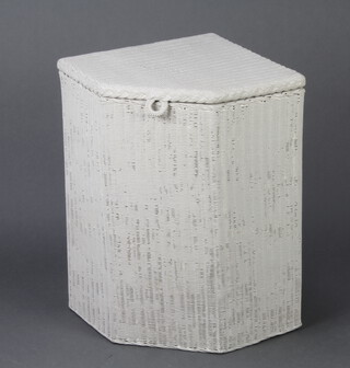 A white painted Lloyd Loom corner linen basket, the base with original paper label 57cm h x 38cm w x 36cm d 