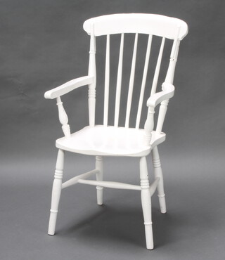 A 19th Century white painted stick and rail back Windsor kitchen/carver chair raised on turned supports with H framed stretcher 
