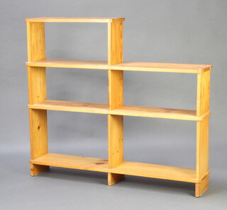 A pine bookcase unit 102cm h x 116cm w x 24cm d 