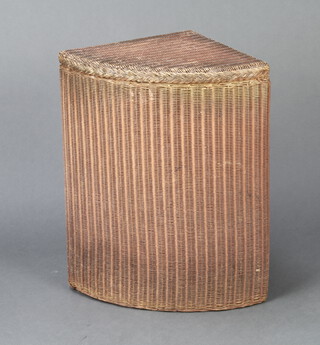 A pink painted Lloyd Loom corner linen basket, base with original label 54cm h x 32cm w x 32cm d 