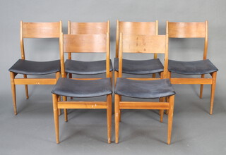 Uniflex, a set of 6 mid Century teak dining chairs with black upholstered seats  