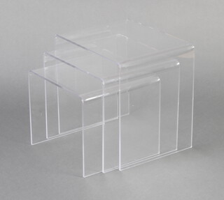 A nest of 3 perspex inter-fitting "ghost" coffee tables