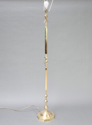 A gilt metal standard lamp on a 10 sided base 57cm h x 23cm d 